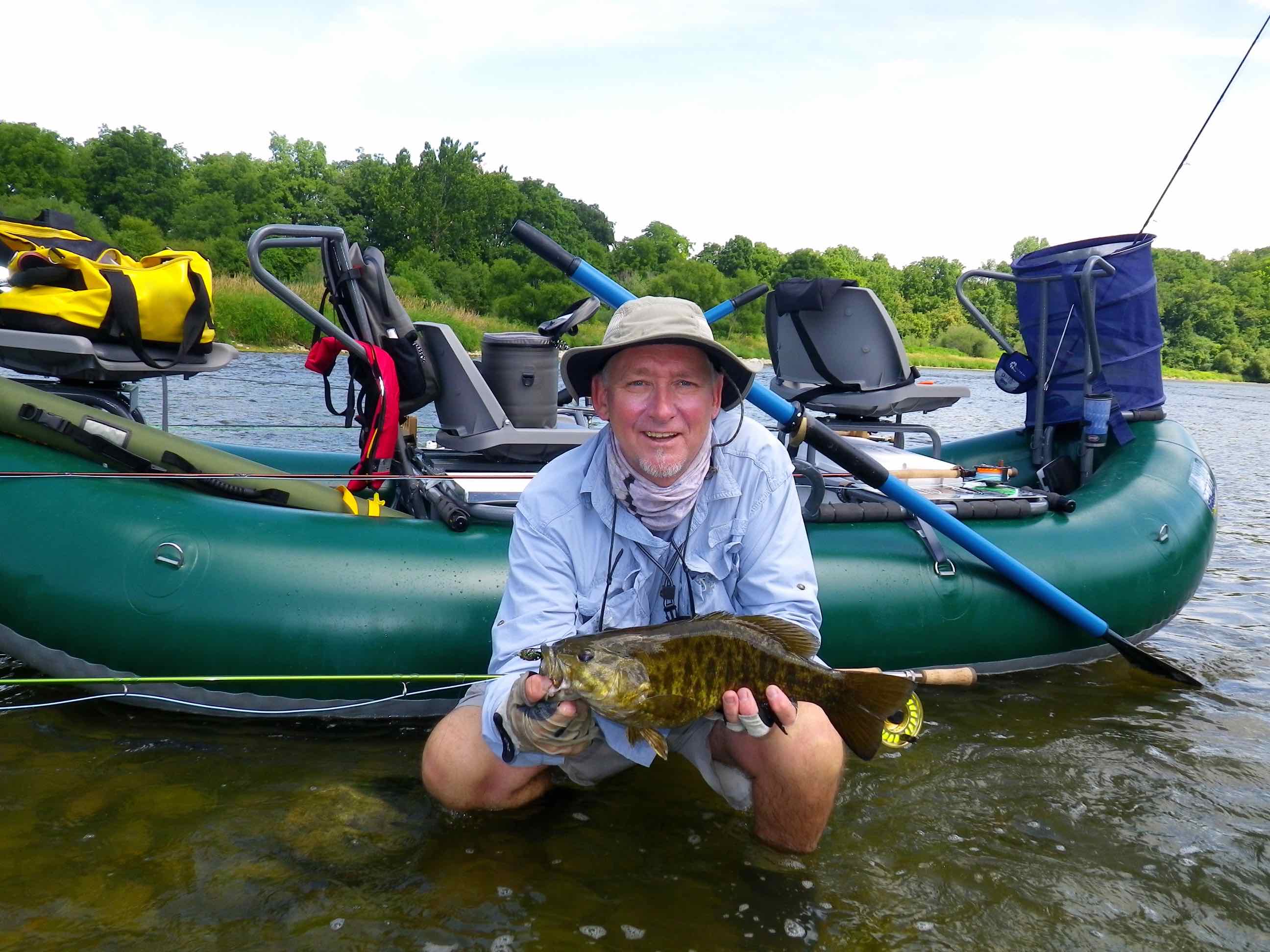 https://thefirstcast.ca/wp-content/uploads/2014/01/Outcast-Pontoon-Boat-Pac-1300-Grand-River-Fly-Rod-Smallmouth-Bass-Resized.jpg
